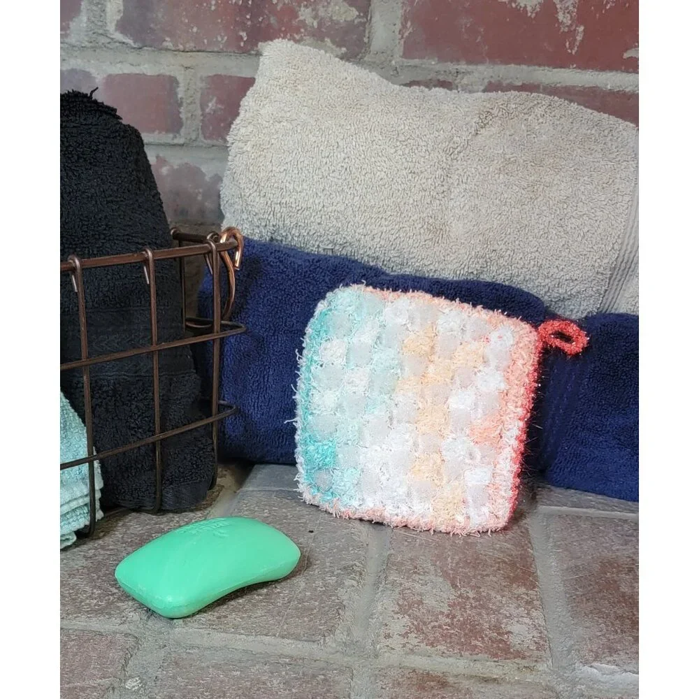 Sea foam green and coral shower scrubby